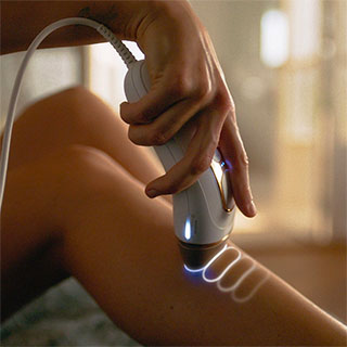 closeup of a person's leg as they use an IPL device